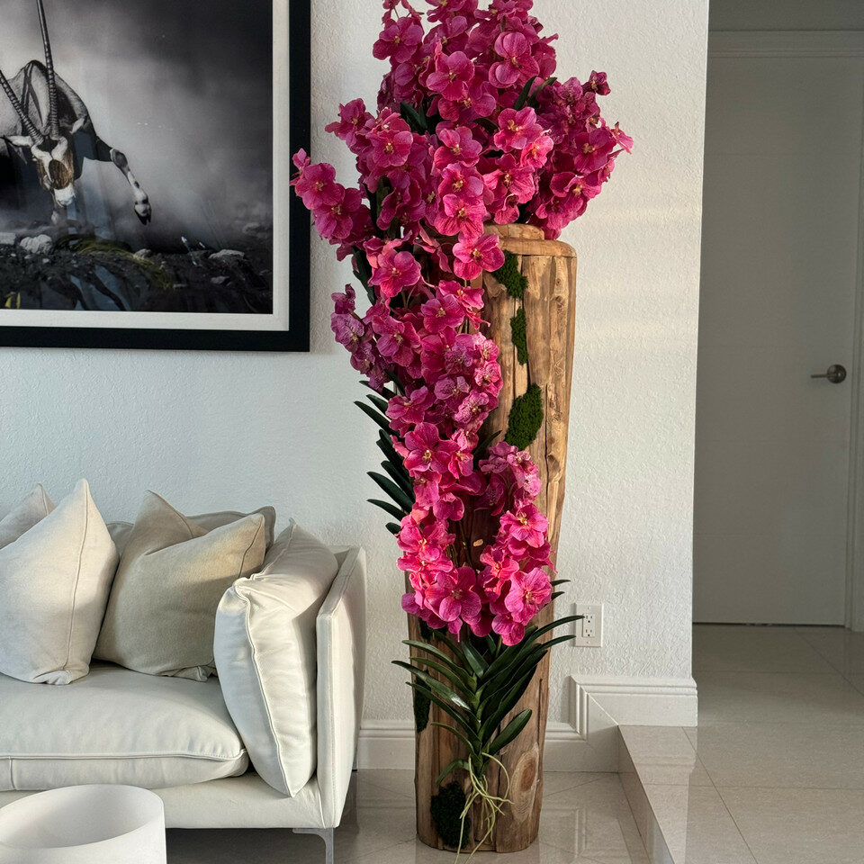 Large teak vase with natural edges and pink Vanda orchids