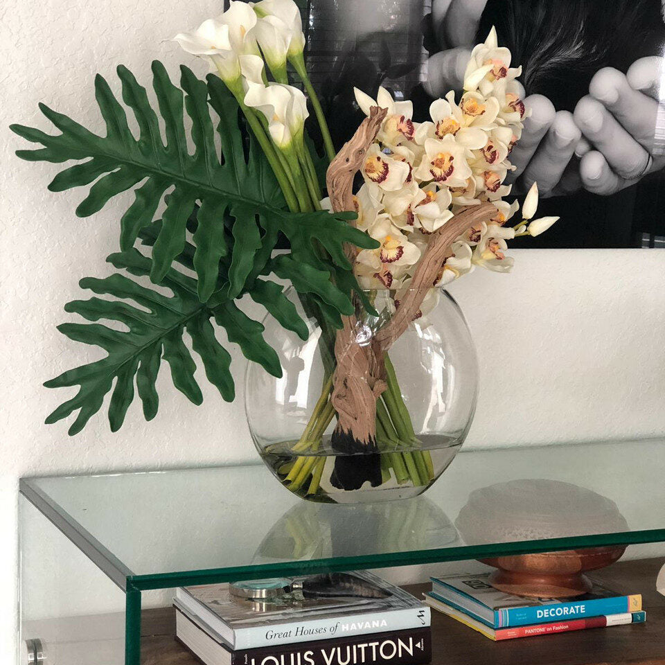 Lunar vase with cymbidiums and callas